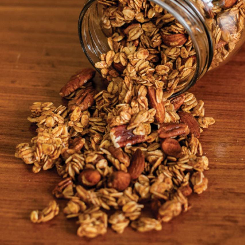 Honey-sweetened chai spiced granola in a clear bag, featuring aromatic spices and artisanal packaging by Euphoric.