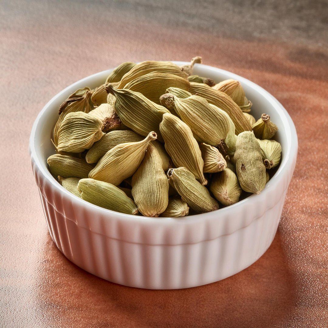 Whole green cardamom pods in a clear package, AGT brand, premium Indian spice, available in 25g and 50g options.