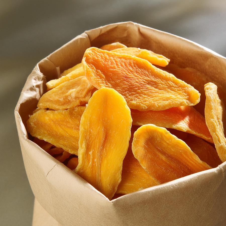 Organic dried mango slices in a clear package by Afrifruta, gluten-free healthy snack option