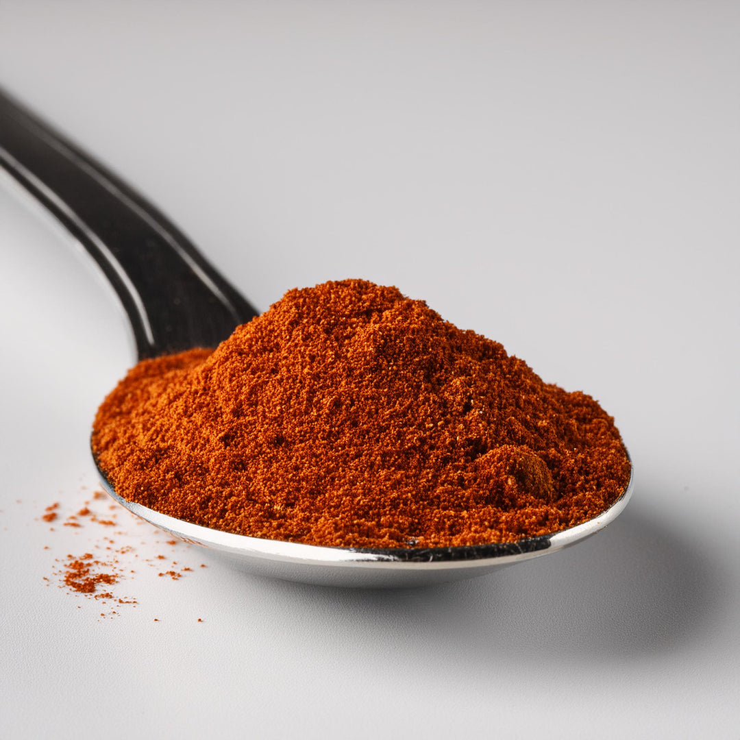 Red paprika spice in a clear 50g Akalwayas container, ideal for enhancing European cuisine flavors.