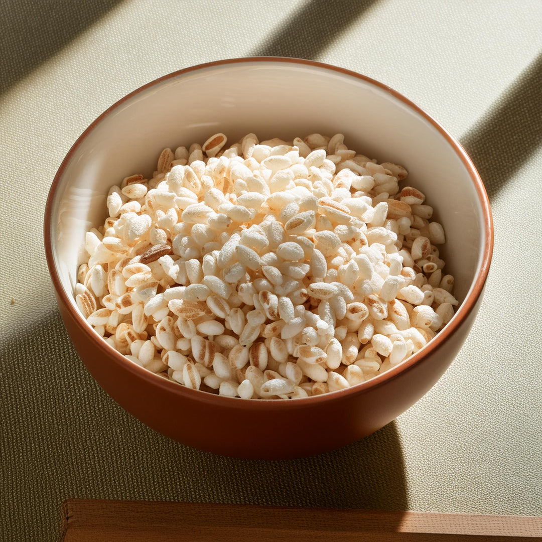 Golden puffed rice cereal in a clear bag, labeled Akalwayas, gluten-free, available in 250g, 500g, and 1kg sizes.