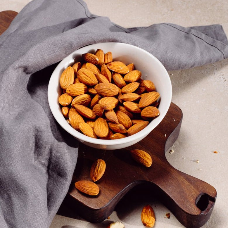 Raw almonds in a clear bag, MultiSnack brand, available in 100g, 250g, and 500g sizes