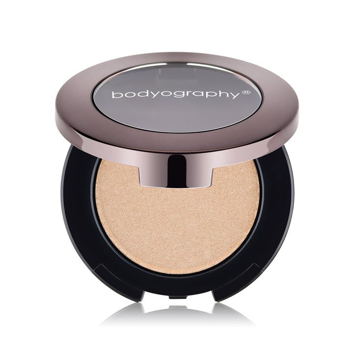 Pressed highlighter powder in Sunrise shade by Bodyography SA, featuring a smooth, shimmering finish for complexion enhancem