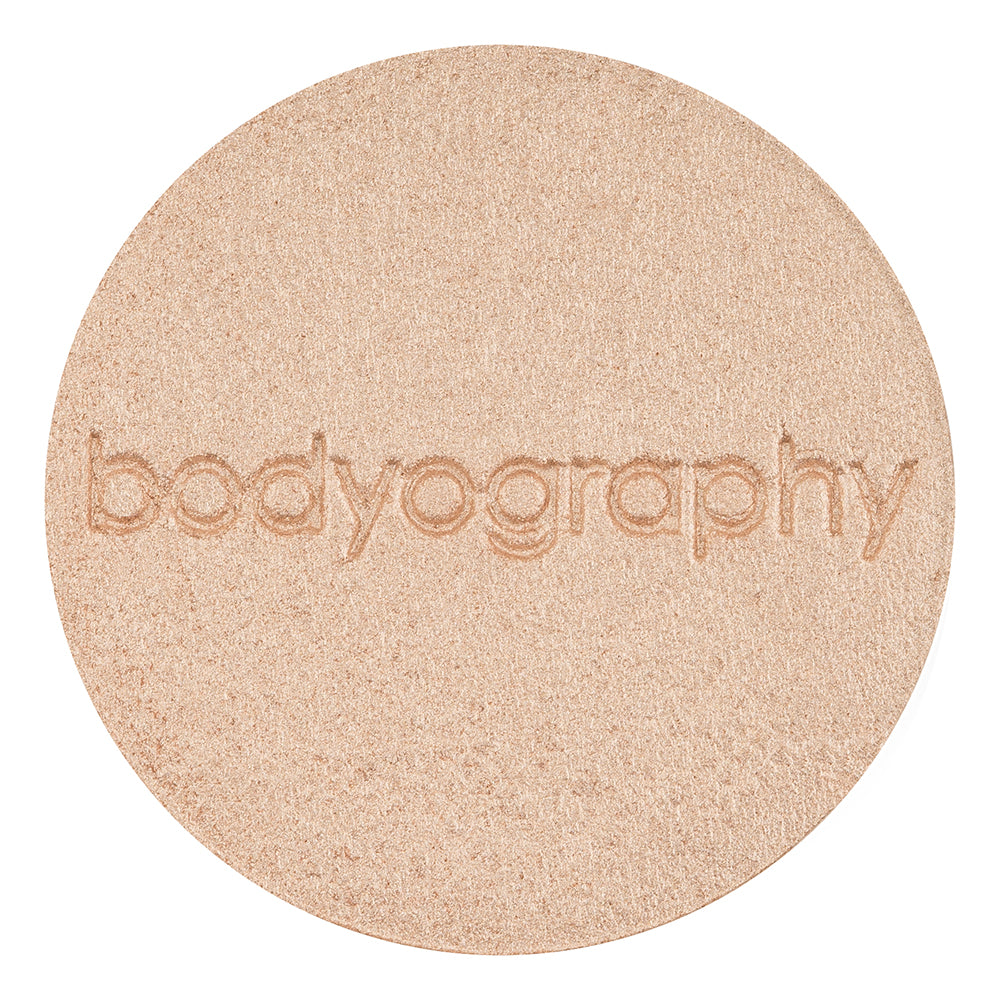 Pressed highlighter powder in Sunrise shade by Bodyography SA, featuring a soft, shimmery finish for complexion enhancement.