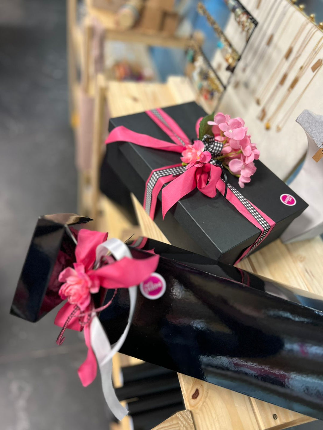 Black SoPurist treat gifts with pink ribbon