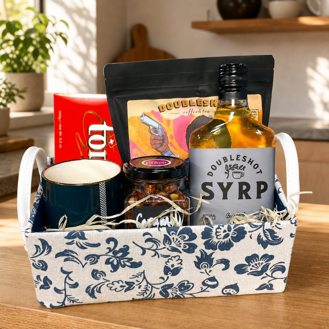 SoPurist coffee hamper with mug, syrup, coffee and snack jar in a warm kitchen